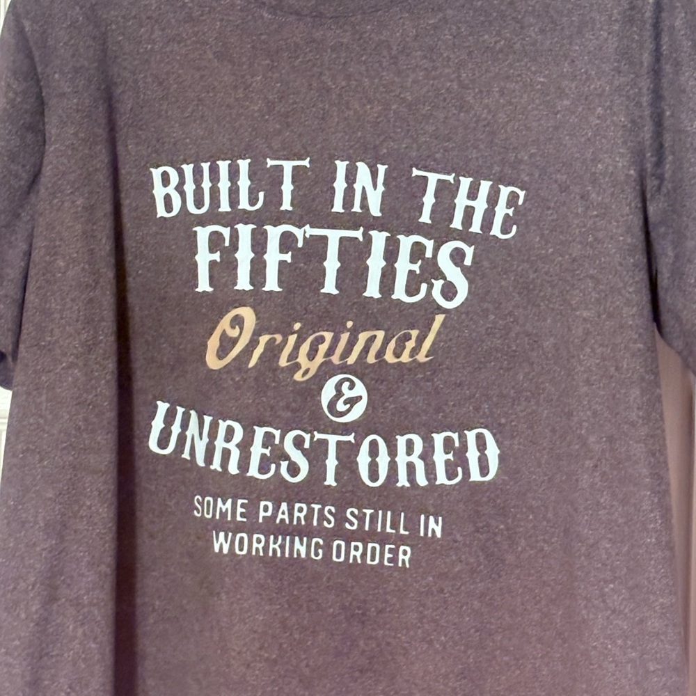 grey Graphic retro t-Shirt with White and Tan Text .